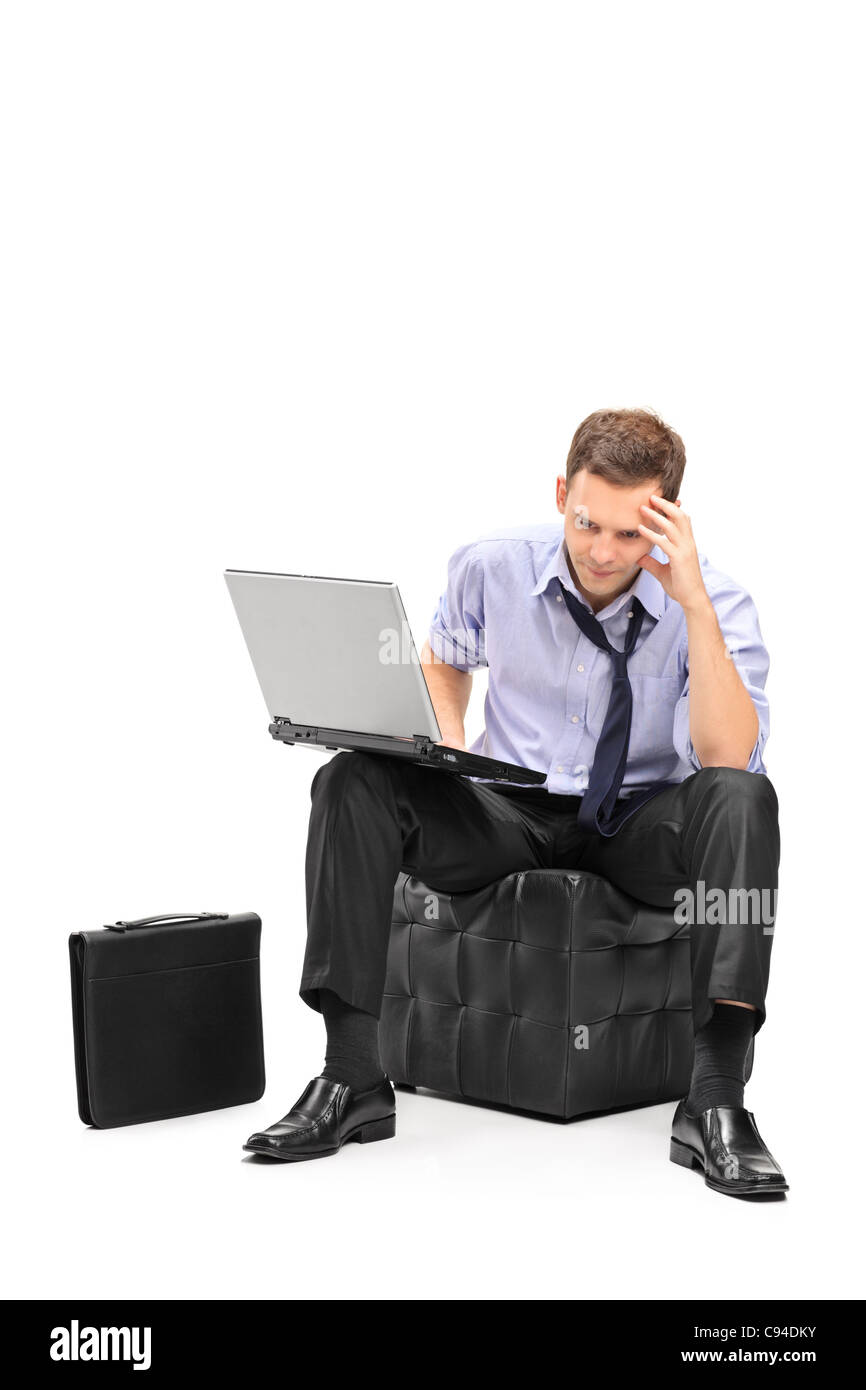 Un deluso dell'imprenditore e il suo computer portatile Foto Stock
