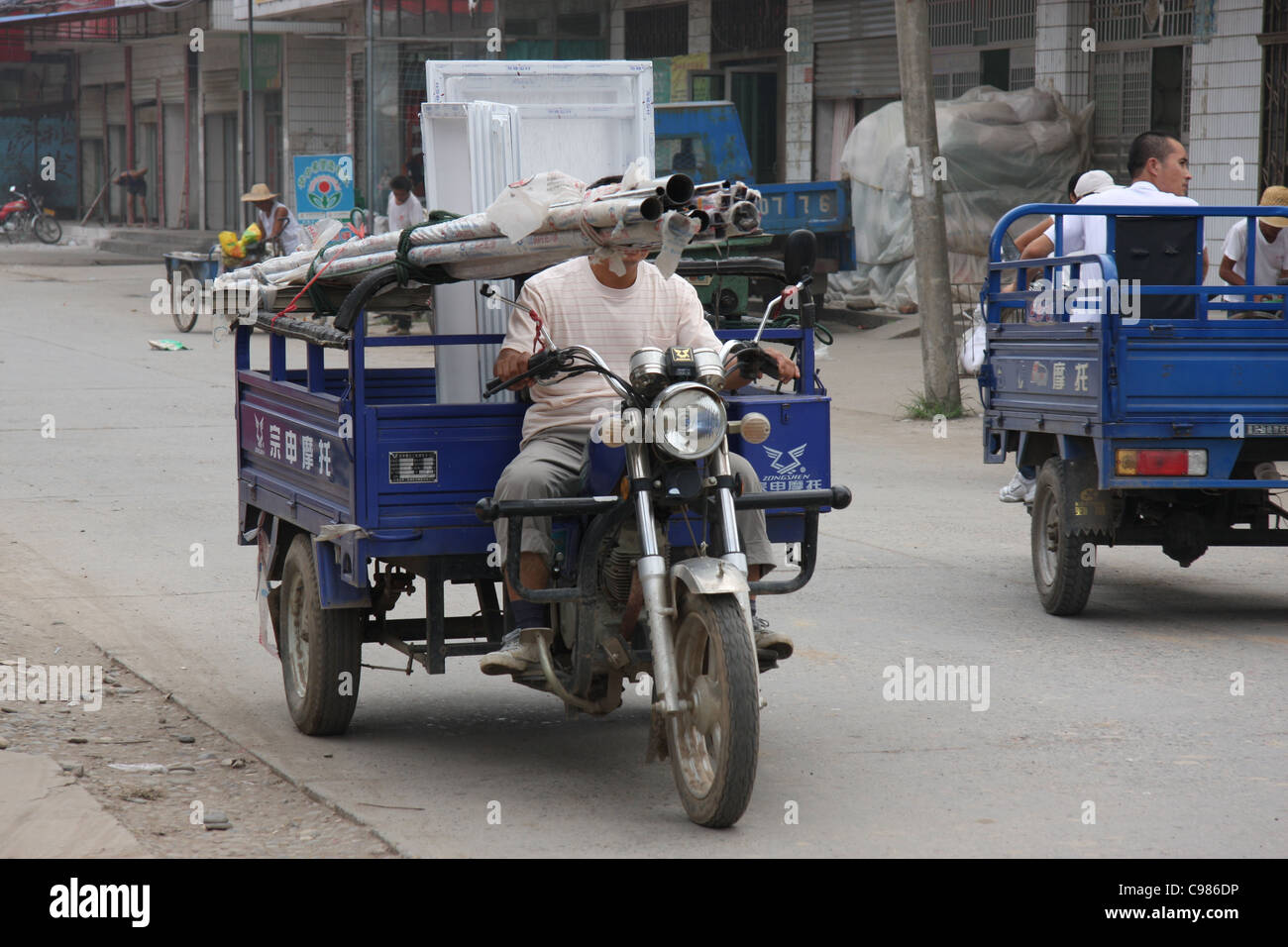 Tre moto della ruota di carrello di trasporto di merci in Jingzhou, Cina Foto Stock