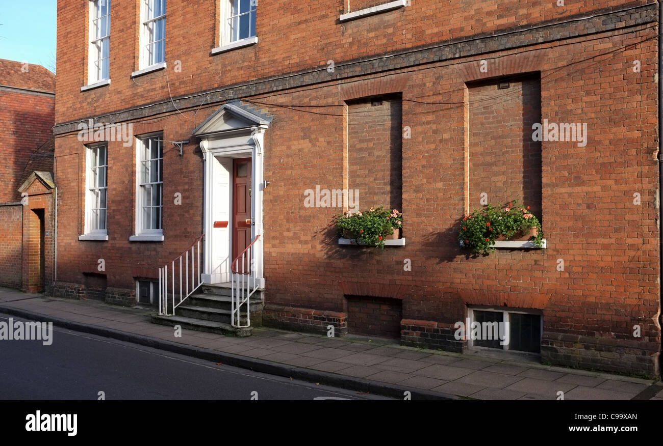 Casa storica in Winchester Regno Unito con finestre murate grazie alla finestra imposta durante il 1600 s da King William 3a Foto Stock