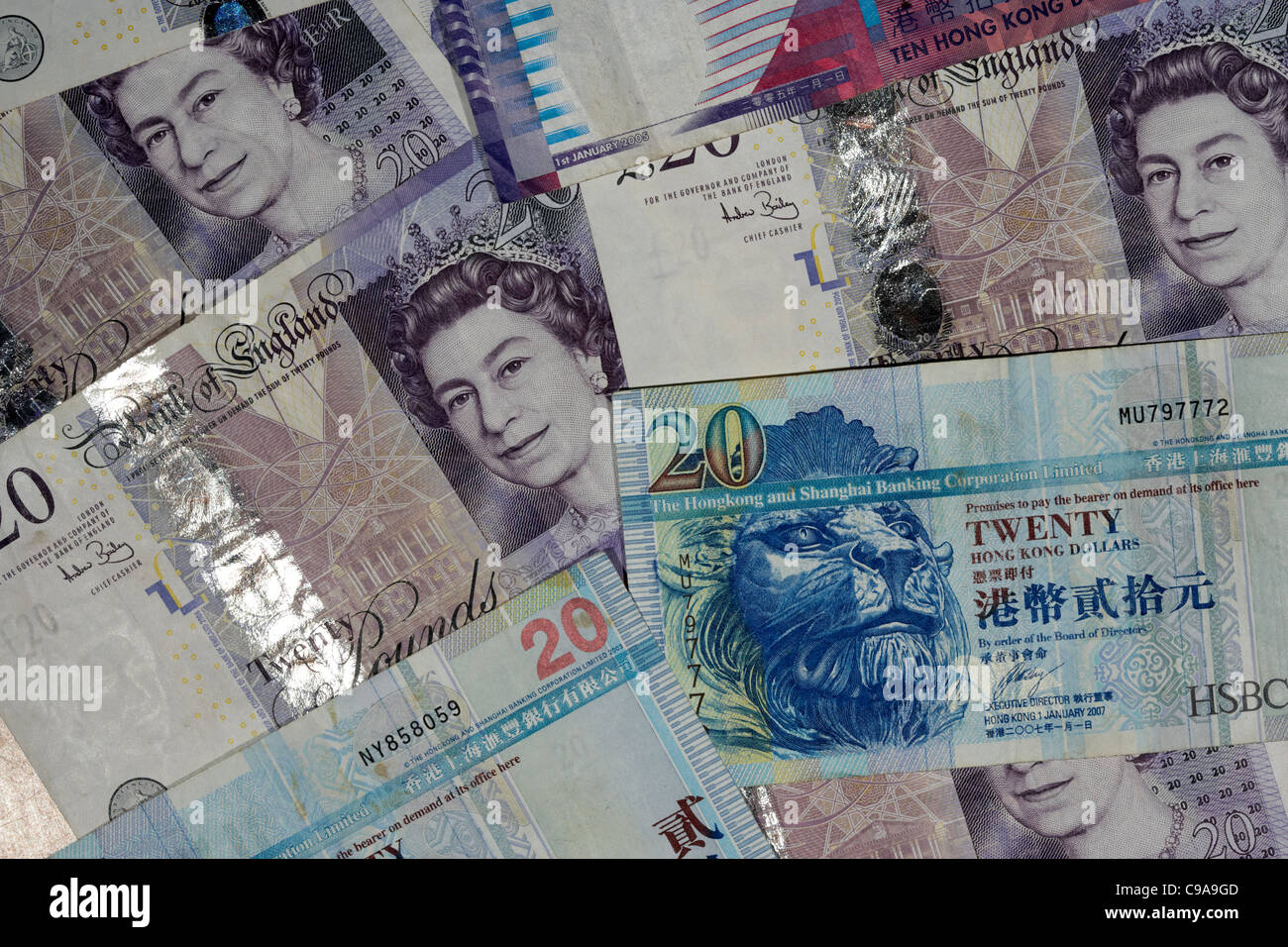 Sterline inglesi e dollari di Hong kong banconote Foto Stock