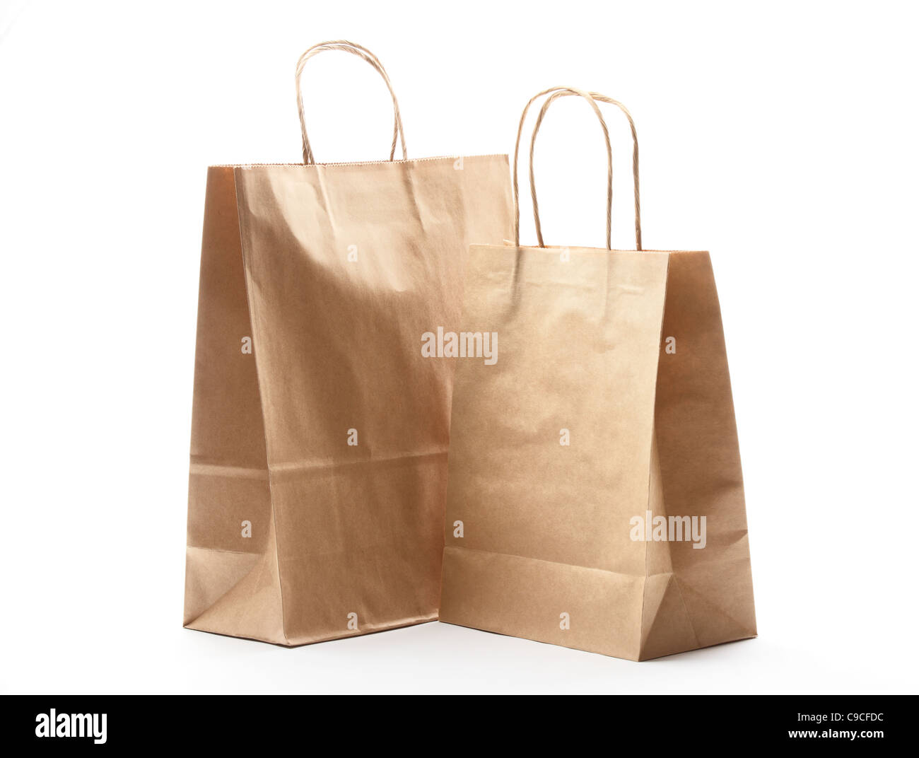 Carta shopping bags isolato su bianco. Foto Stock Carta shopping bags isolato su bianco. Foto Stock