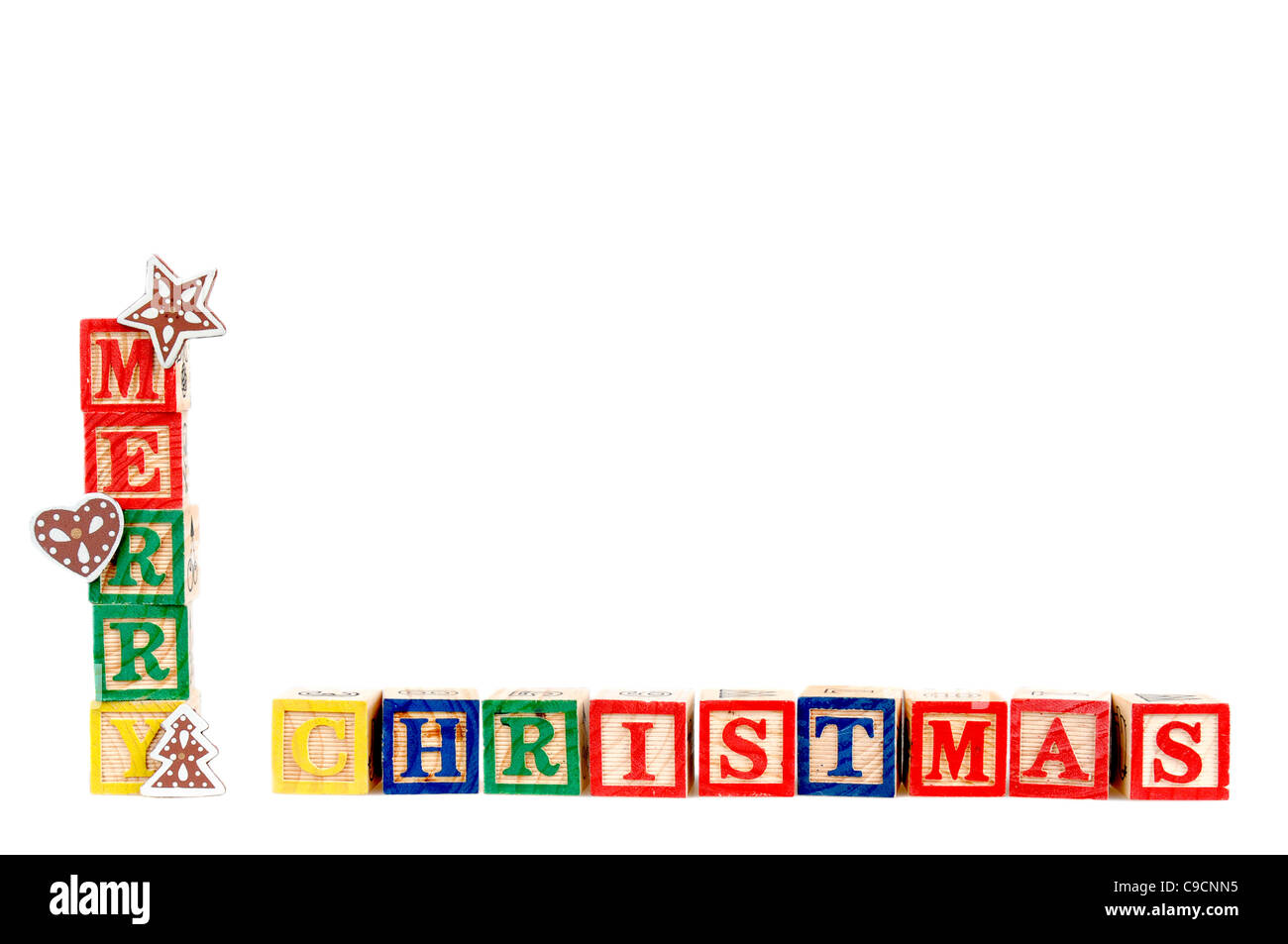 Buon Natale in colorate per bambini lettere blocco isolato su sfondo bianco. Foto Stock