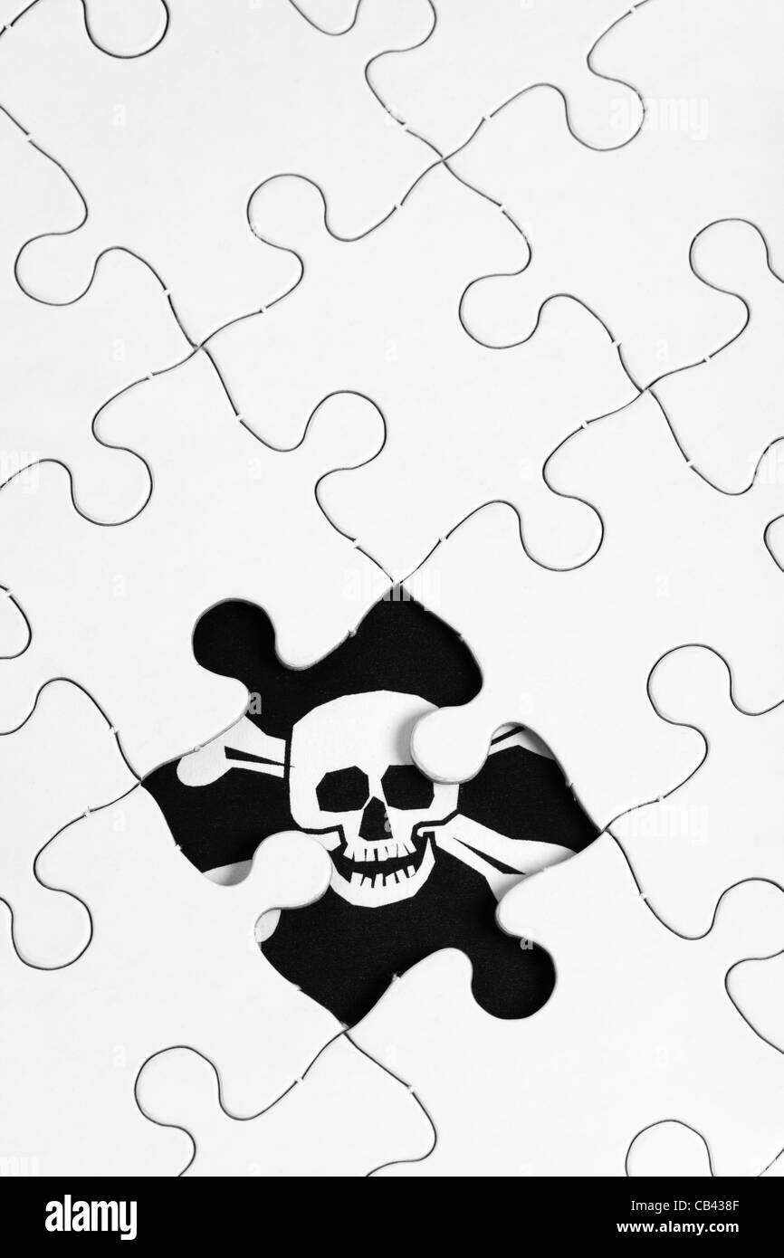 Puzzle e la bandiera dei pirati, concetto di business Foto Stock