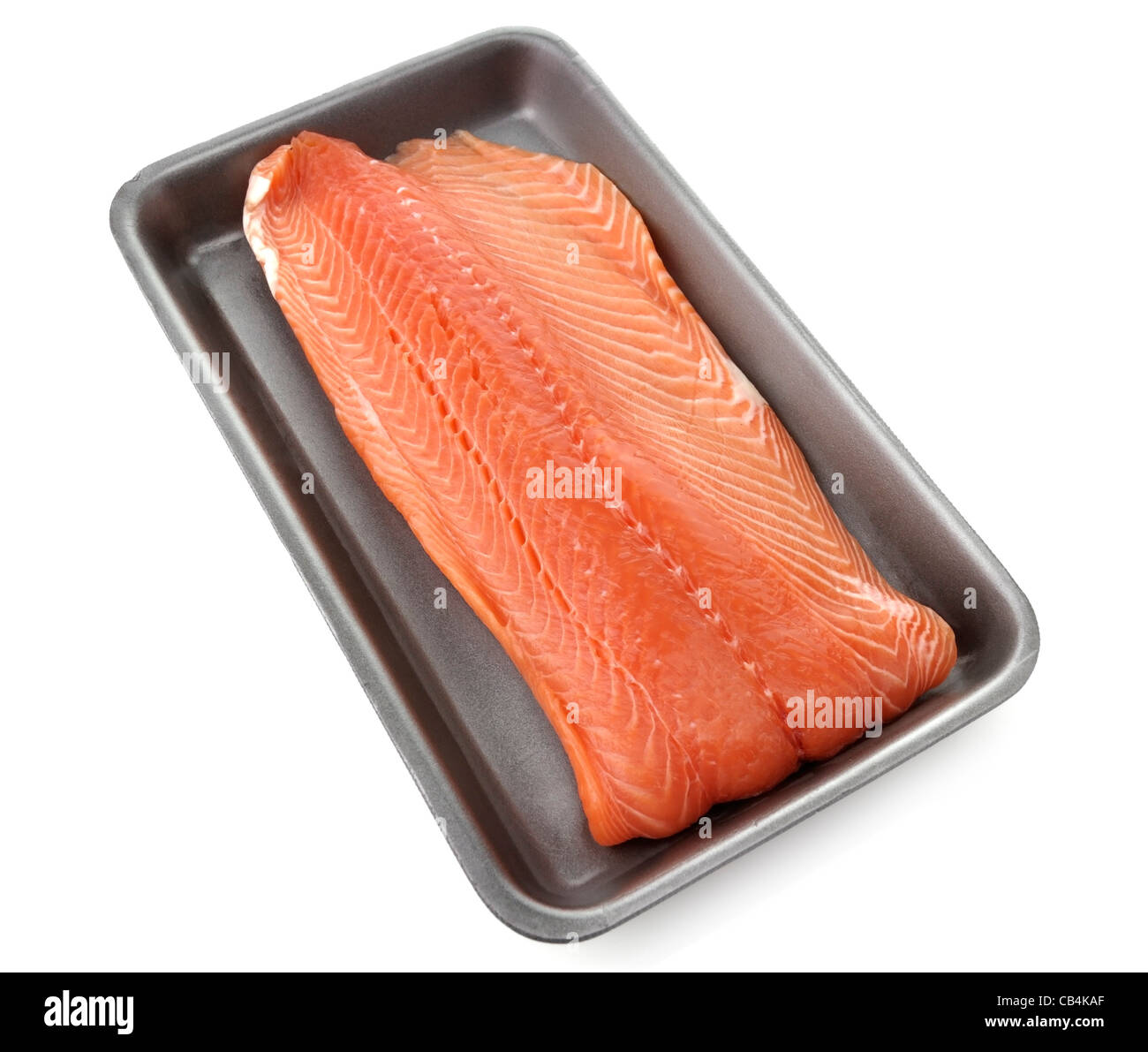Materie Filetto di salmone in un vassoio di plastica Foto Stock