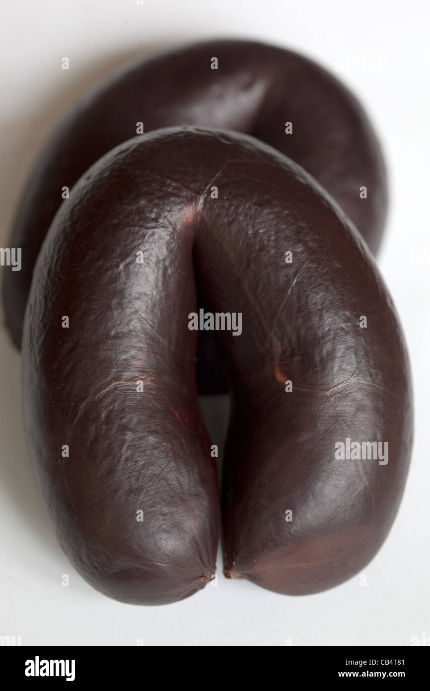 Black Pudding venduto al Bury Market, un esempio dello strano o strano cibo mangiato da persone di tutto il mondo Foto Stock
