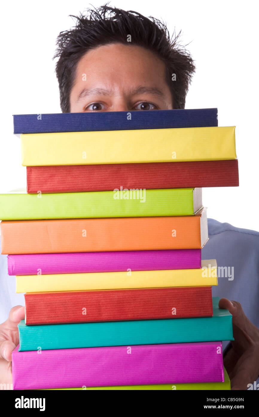 Imprenditore bewind una pila di libri colorati (messa a fuoco selettiva) Foto Stock