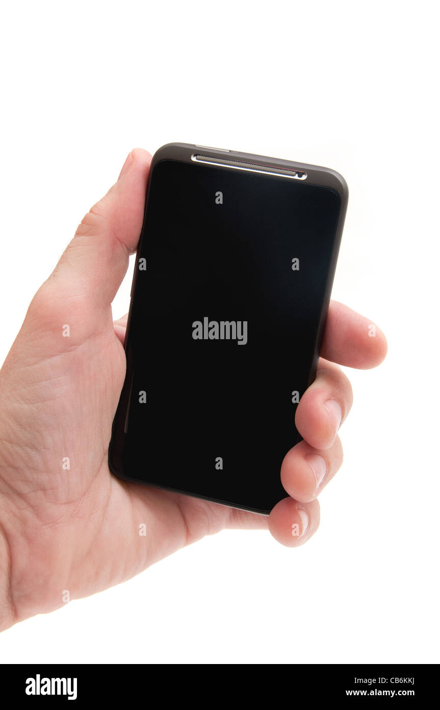 Maschio lato tenendo un smart phone mobile communicator su uno sfondo bianco. Foto Stock