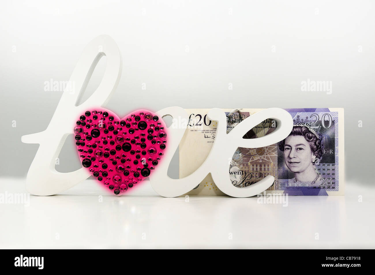 Amore di denaro contante in inglese valuta venti pound note Foto Stock