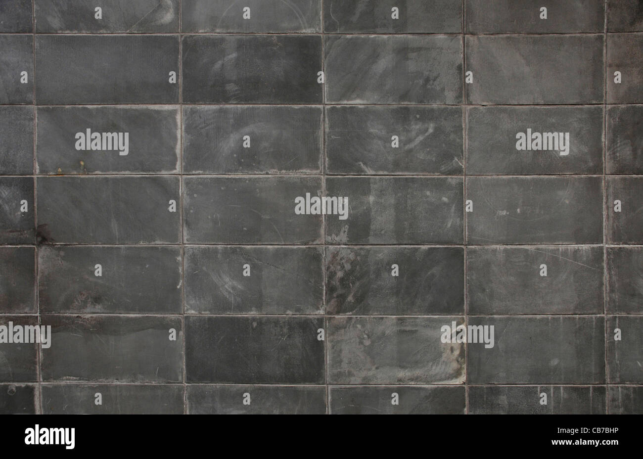 Grigio scuro blocco di muro texture di sfondo di superficie Foto Stock