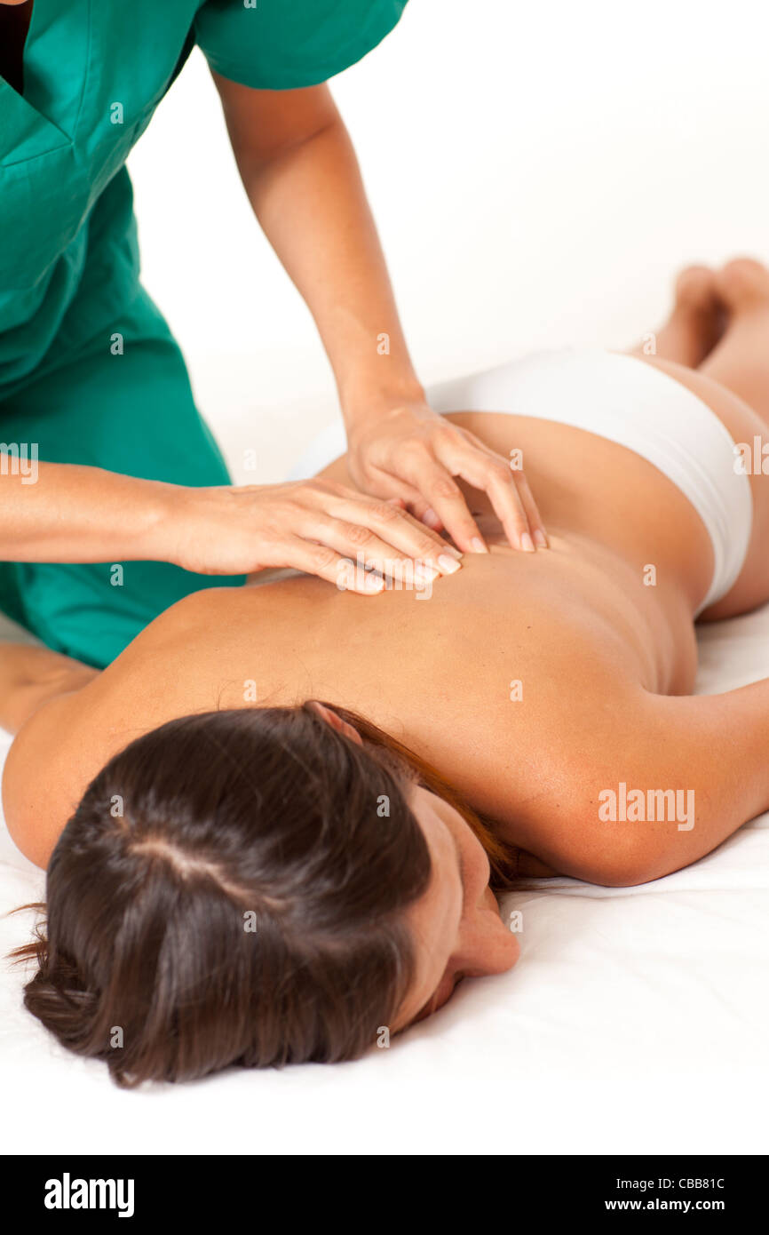 Massaggio schiena su sfondo bianco Foto Stock