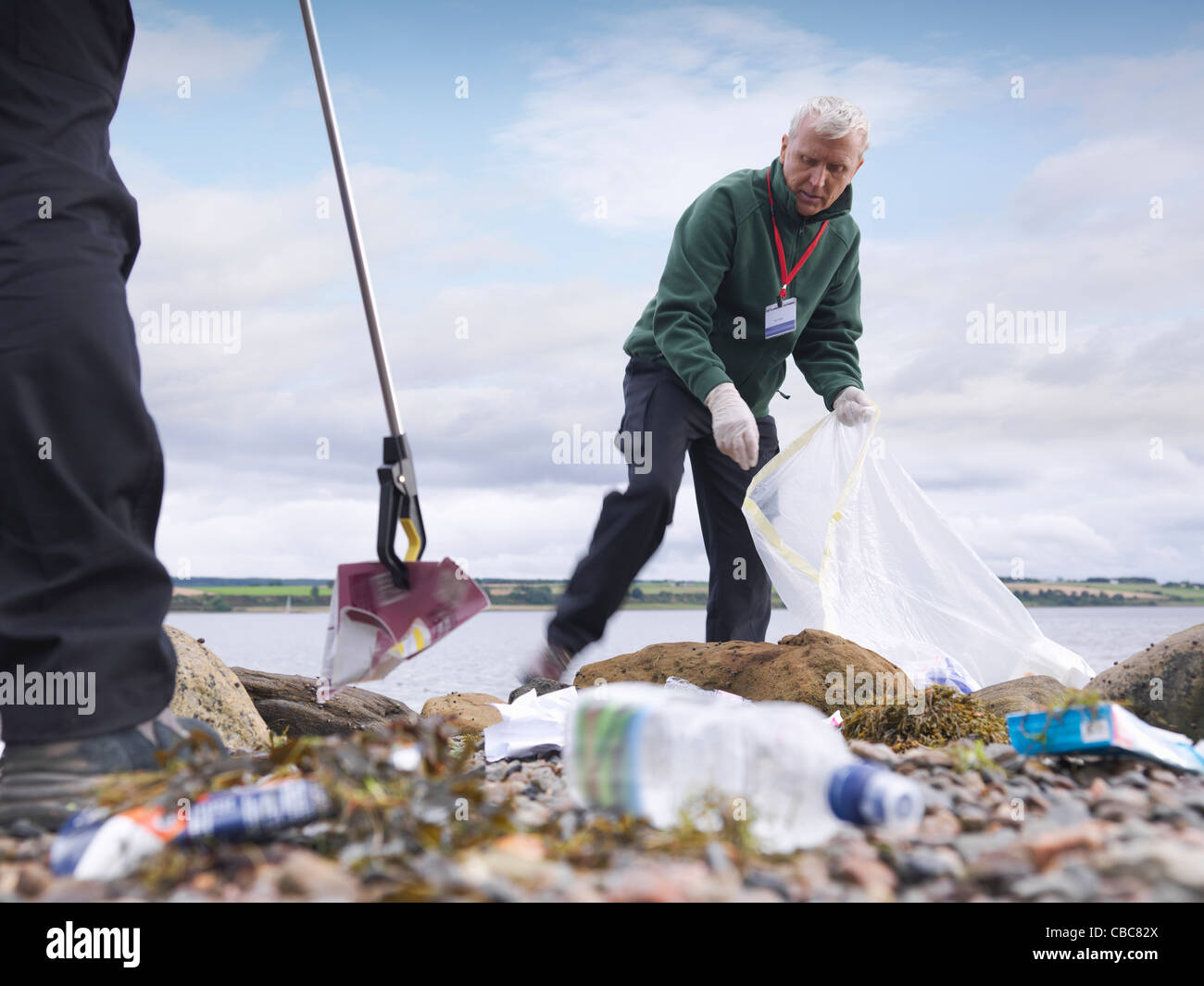 Pulizia ambientalista fino beach Foto Stock