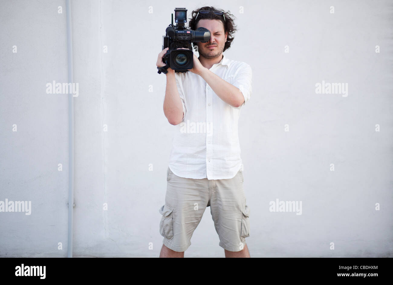 Cameraman con la fotocamera. TV, news, giornalismo, video recoring, record. Fotocamera Sony, la luce rossa. (CTK foto/Martin Sterba, Rene Foto Stock