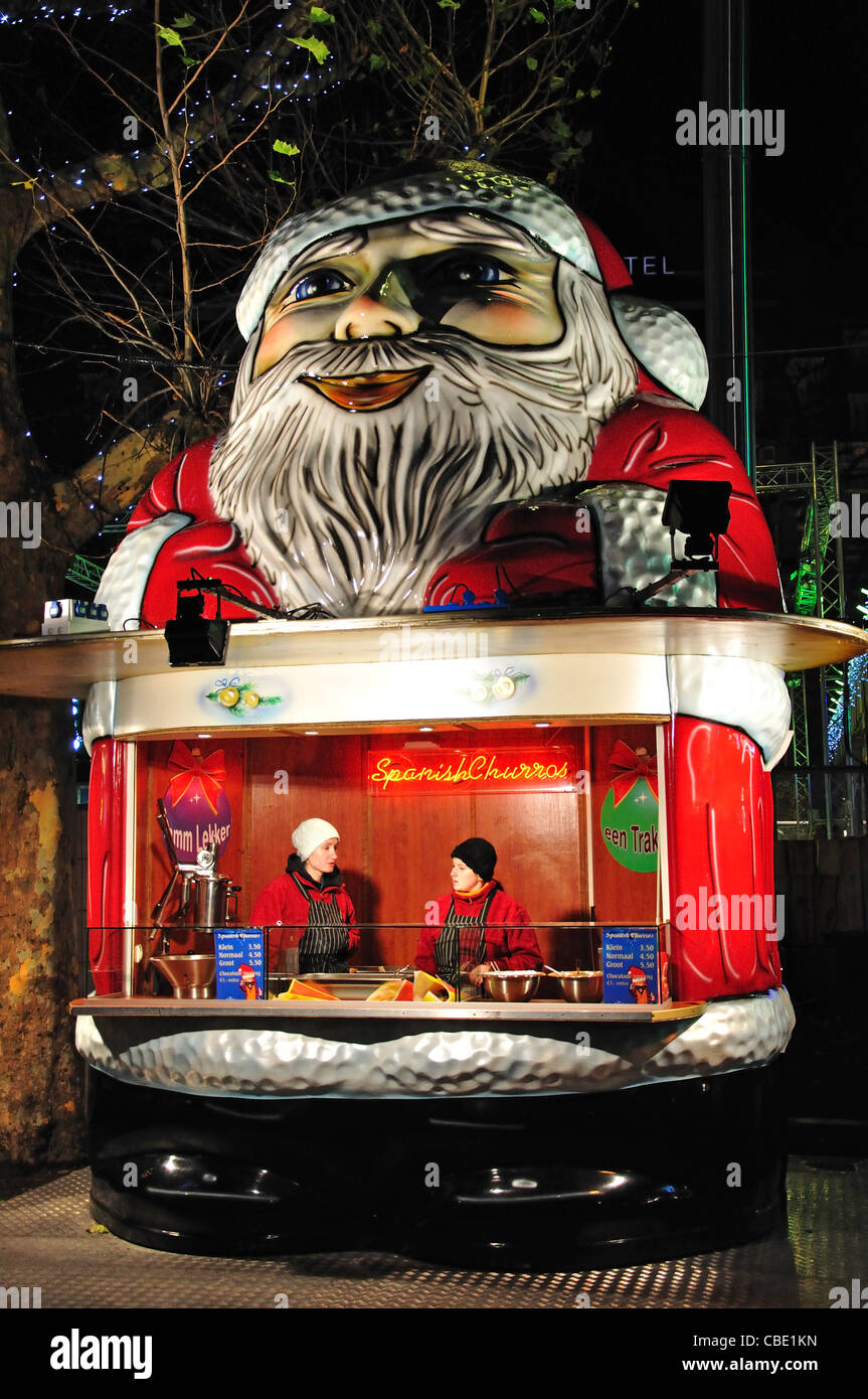 Babbo Natale Spagnolo di stallo churros al mercato di Natale, Rembrandtplein, Amsterdam, Olanda settentrionale, il Regno dei Paesi Bassi Foto Stock