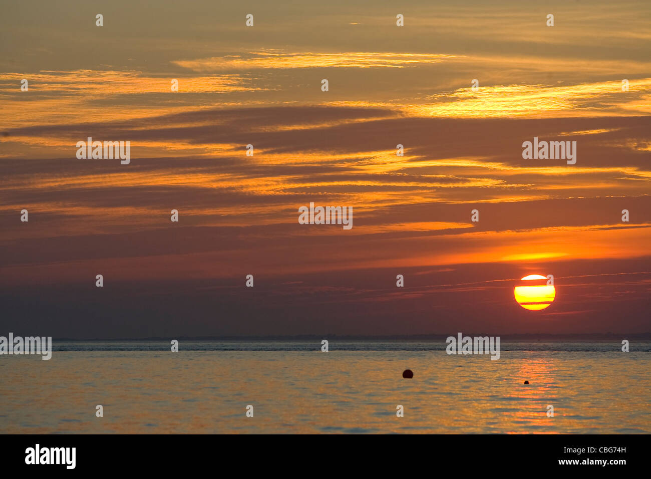 Tramonto, cappone Marsh, Il Solent, cappone, Isle of Wight, England, Regno Unito Foto Stock