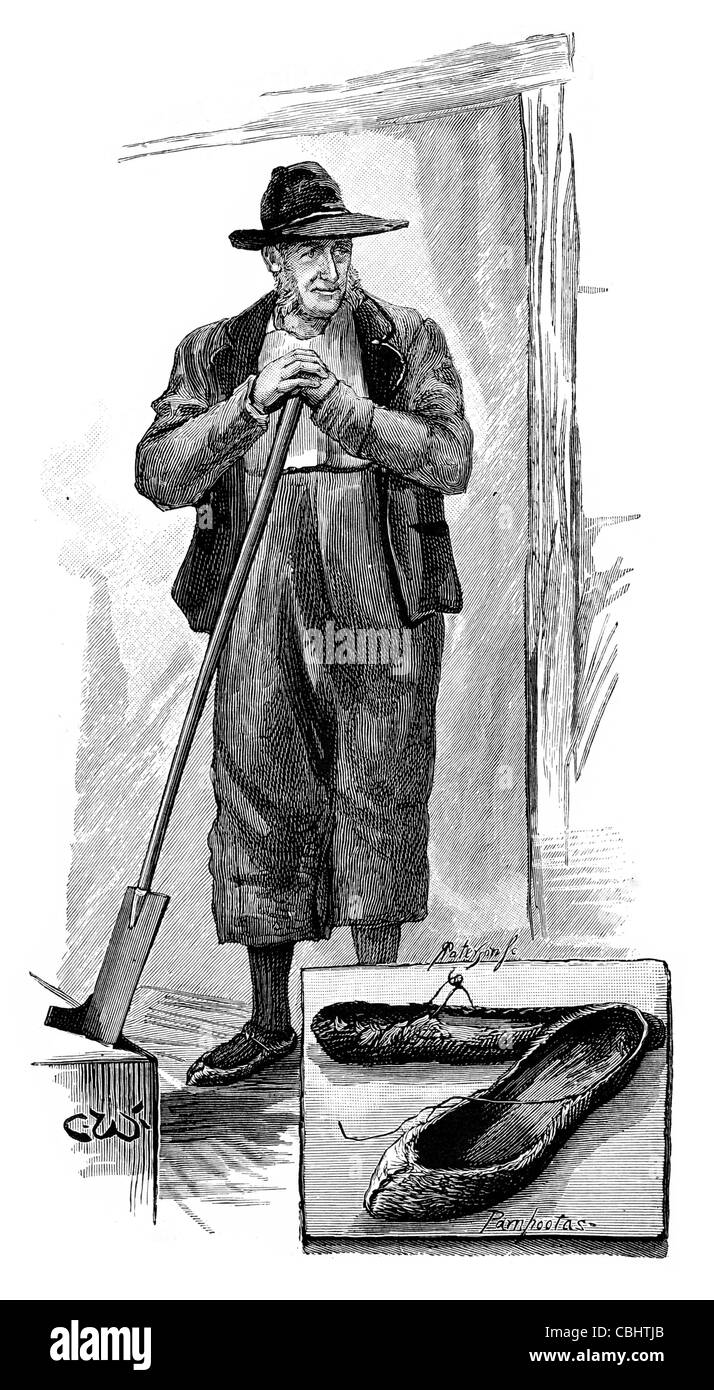 Arran Islander Peatland torba turf Isole Aran Galway Bay Irlanda taglierina pala a forcella nativo periodo irlandese costume scarpe scarpe Foto Stock