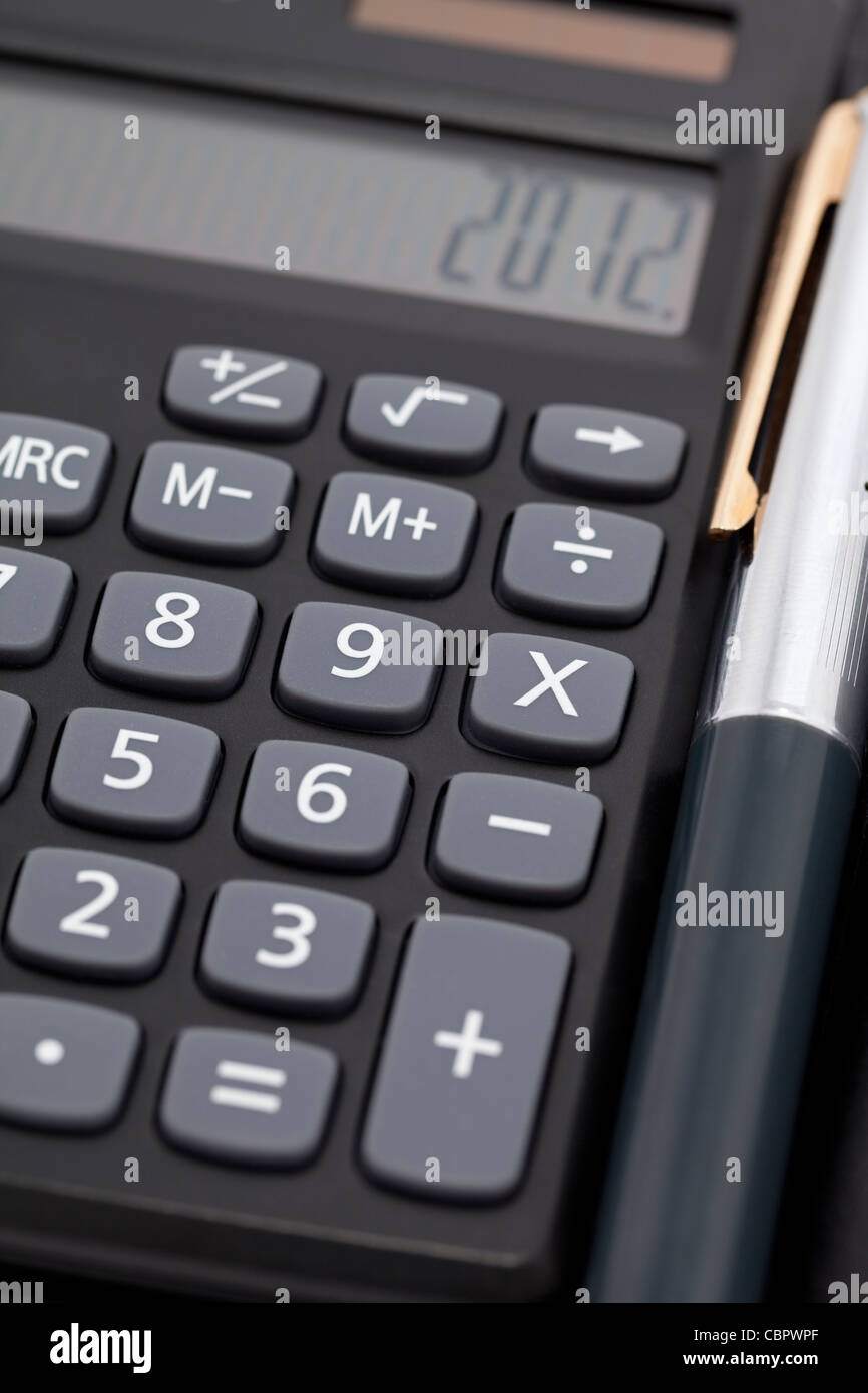 Nero calcolatrice tascabile di calcolo come sfondo Foto Stock