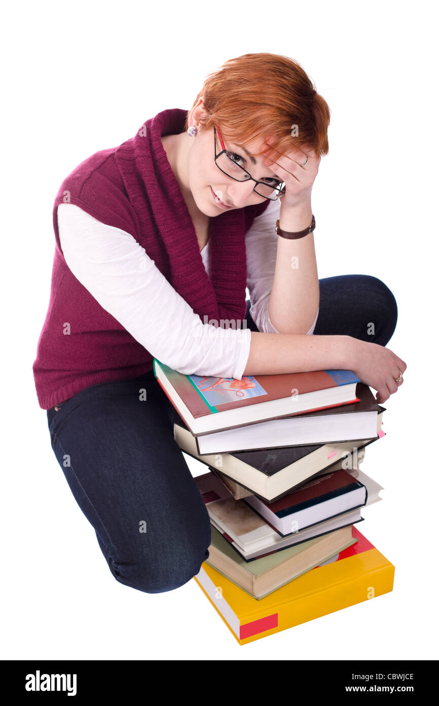 Studente ragazza con molti libri isolati su sfondo bianco Foto Stock