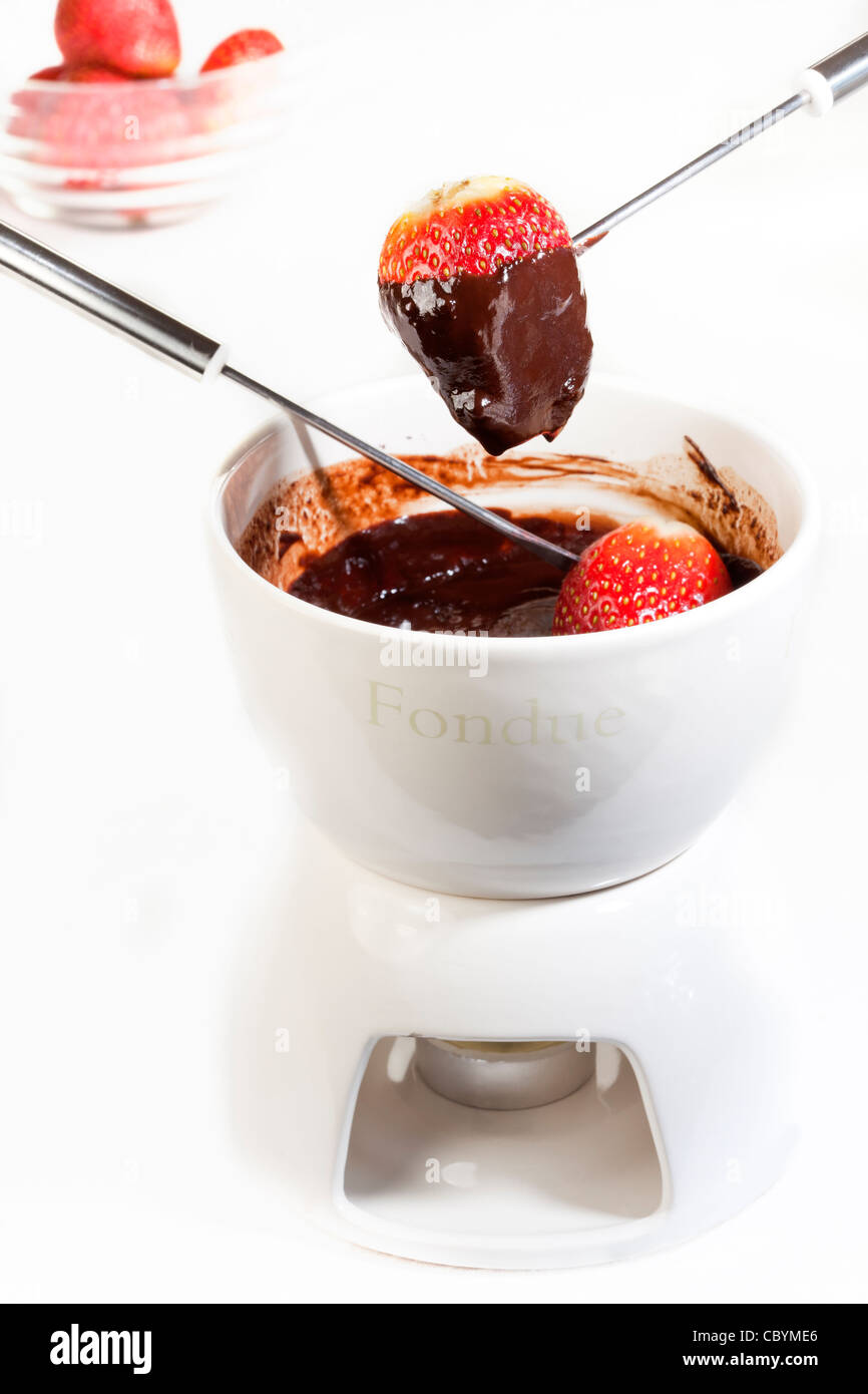 La Fonduta di cioccolato con fragole Foto Stock