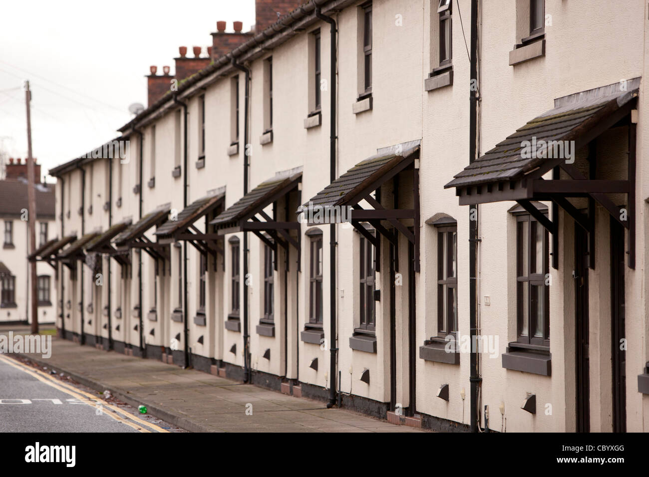 Una fila di lavoratori identici cottages presso il villaggio di Vulcan in Winnick, Warrington Foto Stock