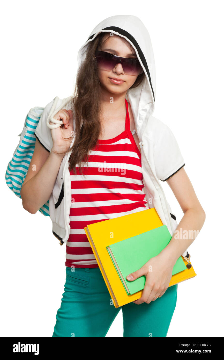 Elegante ragazza adolescente indossando sfumature in piedi con libri Foto Stock