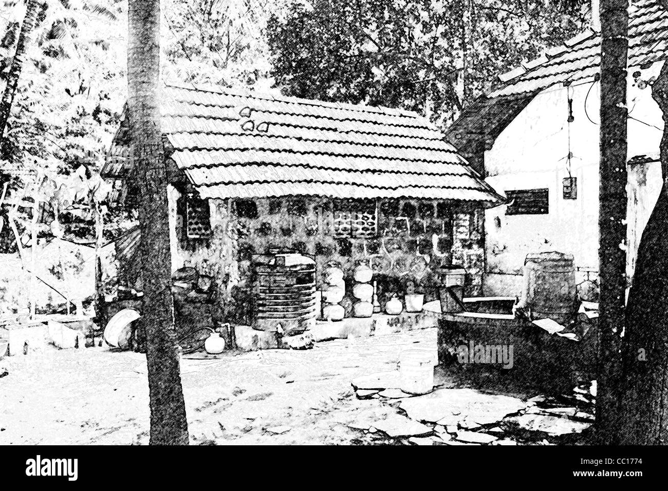 Cottage di foresta nel cuore del Kerala India insieme in una radura, metà giornata sole, cottagers artefatti, acqua ben maturi alberi Foto Stock
