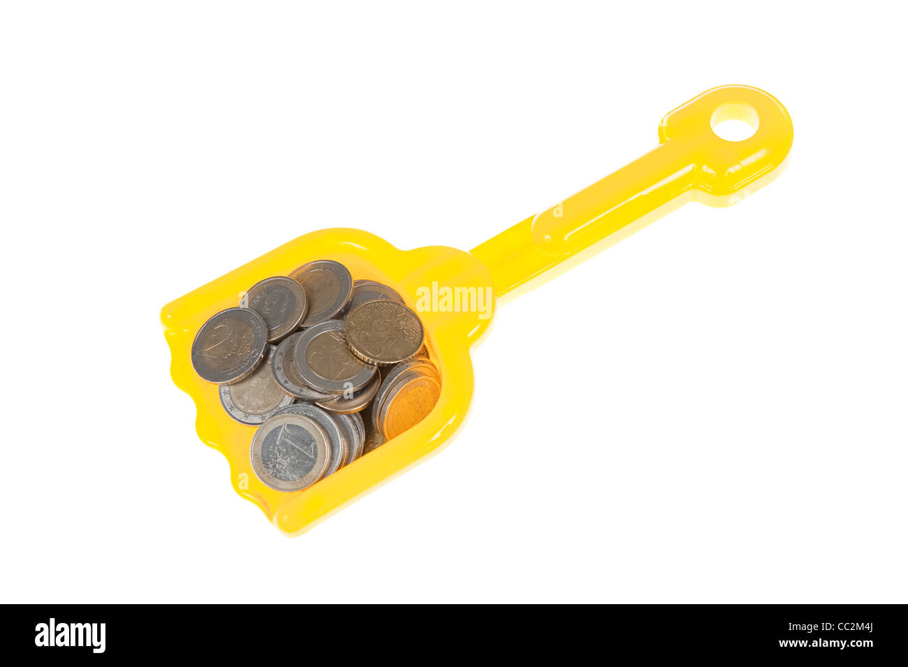 Paletta giocattolo riempito con le monete in euro Foto Stock