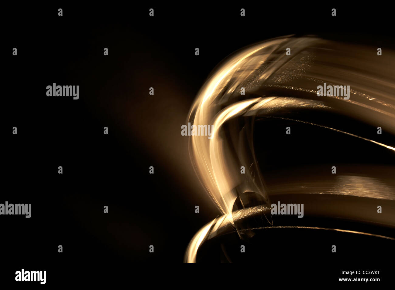 Abstract Golden volute su sfondo nero Foto Stock
