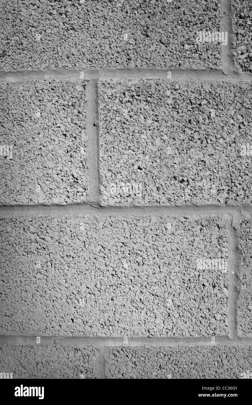 Calcestruzzo o pietra costruzione di blocchi di colore grigio con malta e cemento Foto Stock