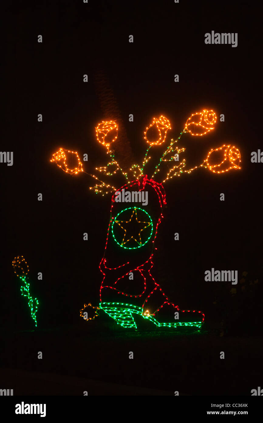 Natale Luce Display a Moody Gardens, Galveston, Texas. Stivale cowboy e giallo rose simboleggiano lo stato del Texas. Foto Stock