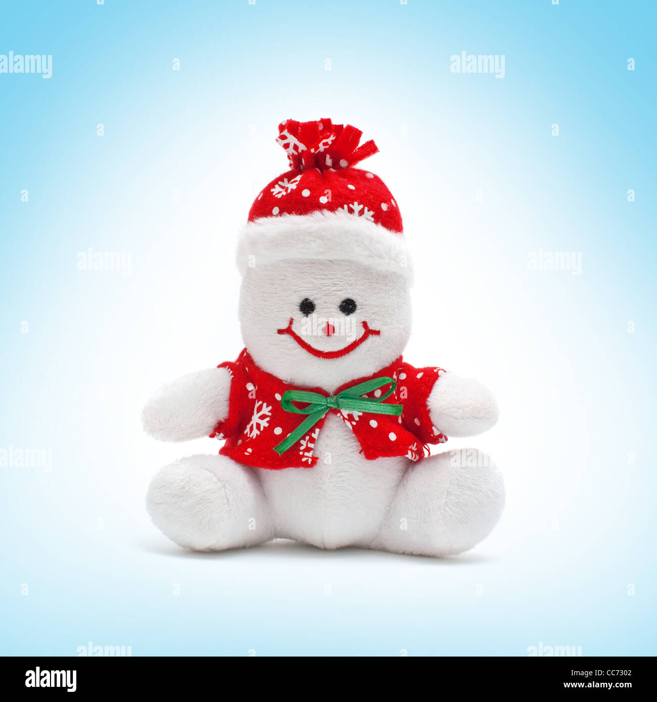 Pupazzo di neve sorridente toy vestito con sciarpa e cappuccio Foto Stock
