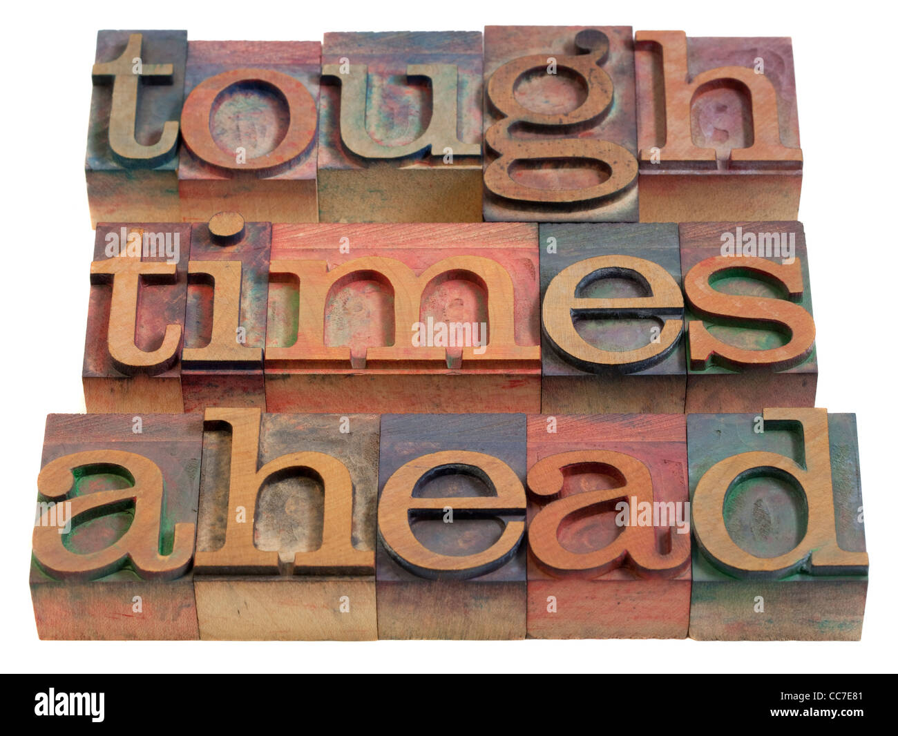 Tough times ahead - avvertimento di legno vintage tipografia blocchi, macchiata di inchiostri a colori, isolato su bianco Foto Stock