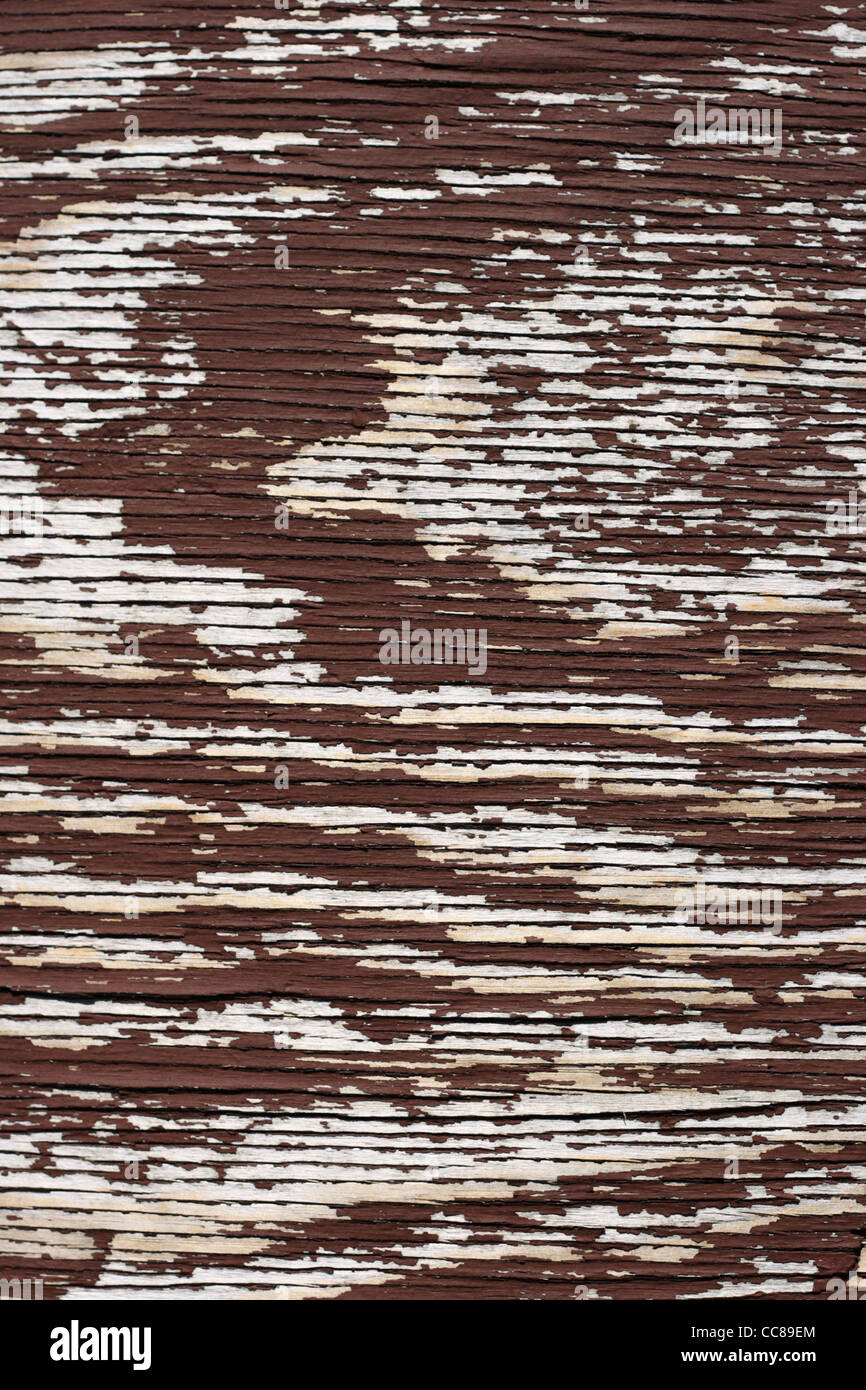 Vecchio verticale marrone sfaldatura dipinta sullo sfondo di legno compensato Foto Stock