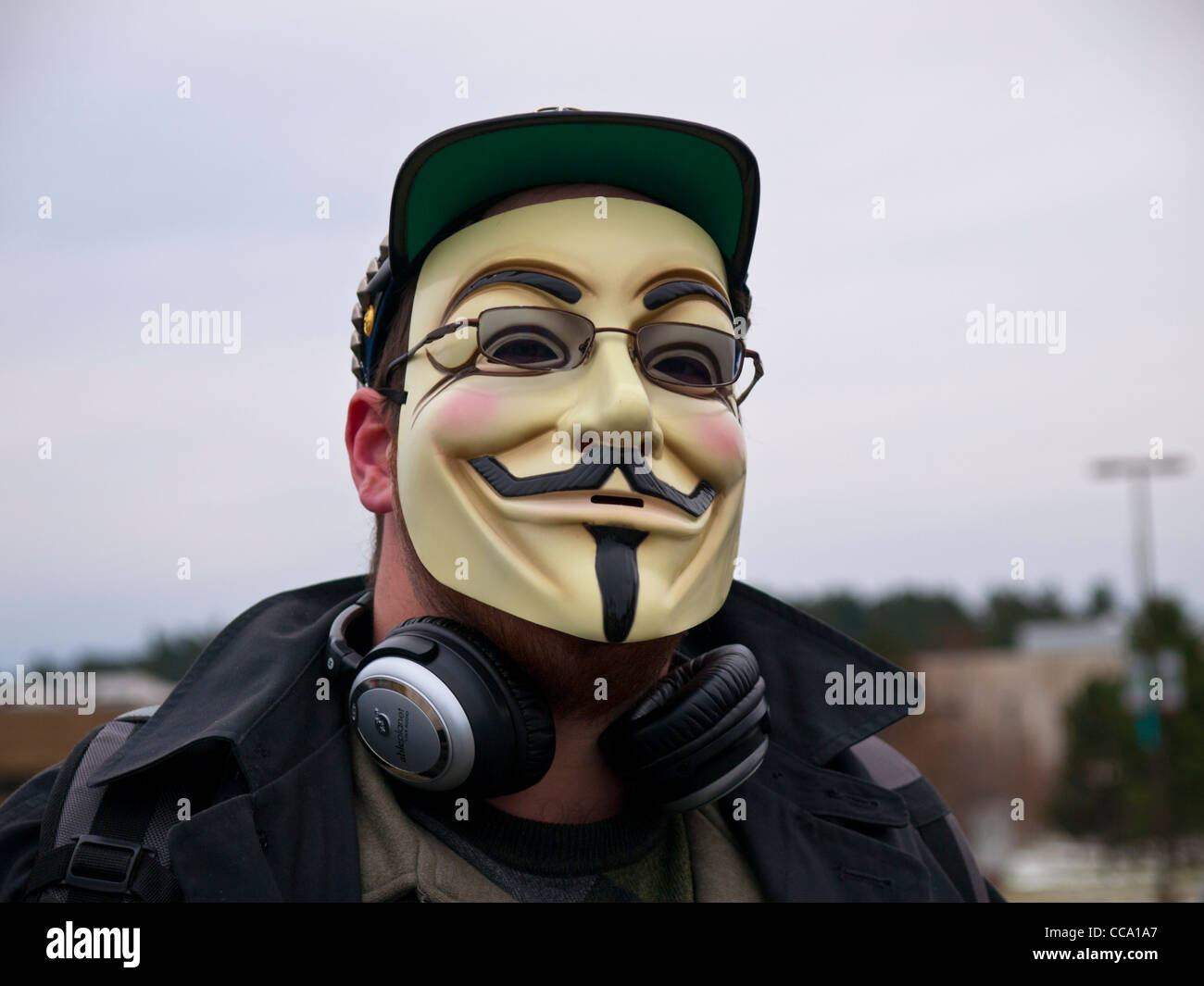 Occupare protester su gennaio 16 2012 Martin Luther King giorno di Ann Arbor Michigan usa questo uomo è indossare una maschera Foto Stock