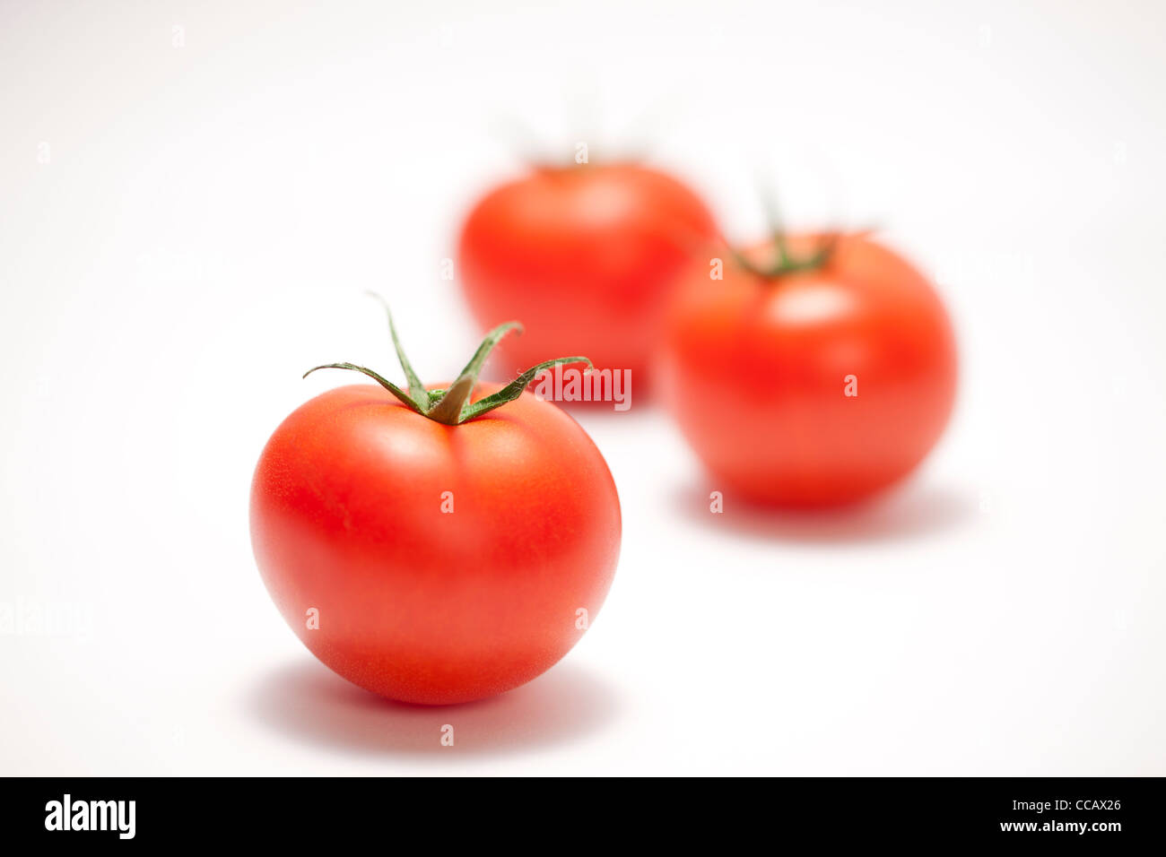 Tre pomodori Foto Stock