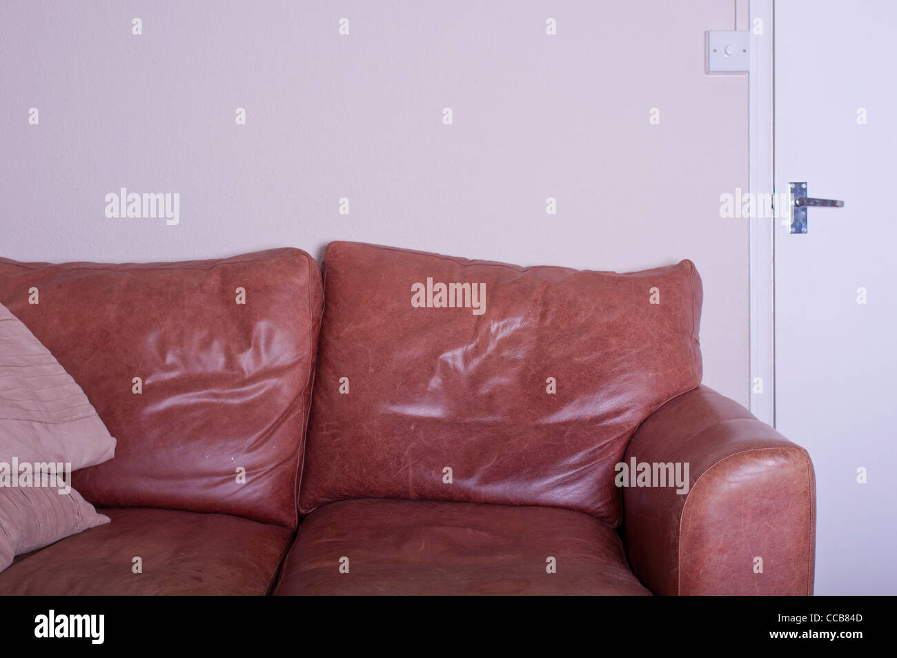 Vecchi divani in pelle marrone. Foto Stock