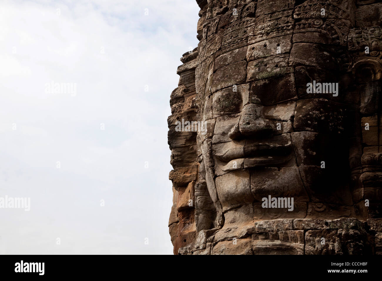 Particolare del volto del Buddha Sorridente, tempio Bayon, Angkor Thom, area di Angkor, Siem Reap, Cambogia, Asia Foto Stock