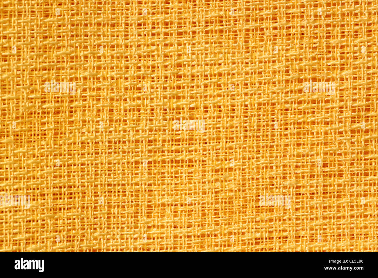 Modello di tessuto di colore giallo con un intreccio lasco Foto Stock
