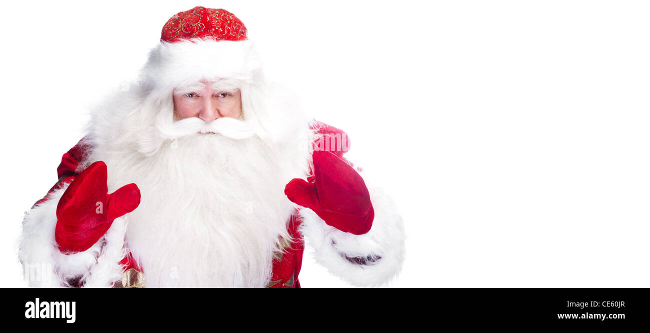 Tema Natale: Santa Claus si inchinano qualcosa dai suoi bracci Foto Stock