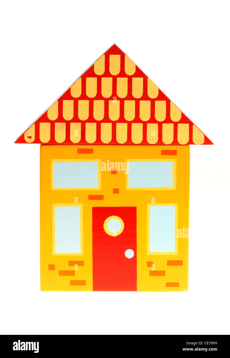 Immagine di simbolo. Vivere in una città, villaggio, alloggiamento. Colorato la costruzione di blocchi di legno. Giocattoli. Foto Stock