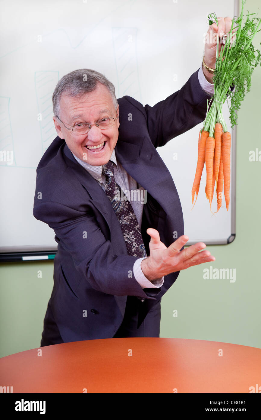 Il grande motivatore carote penzolanti Foto Stock