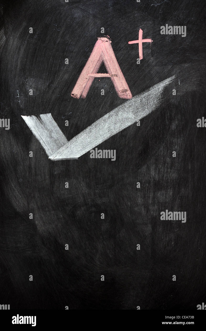 Un plus scritti su una lavagna Foto Stock