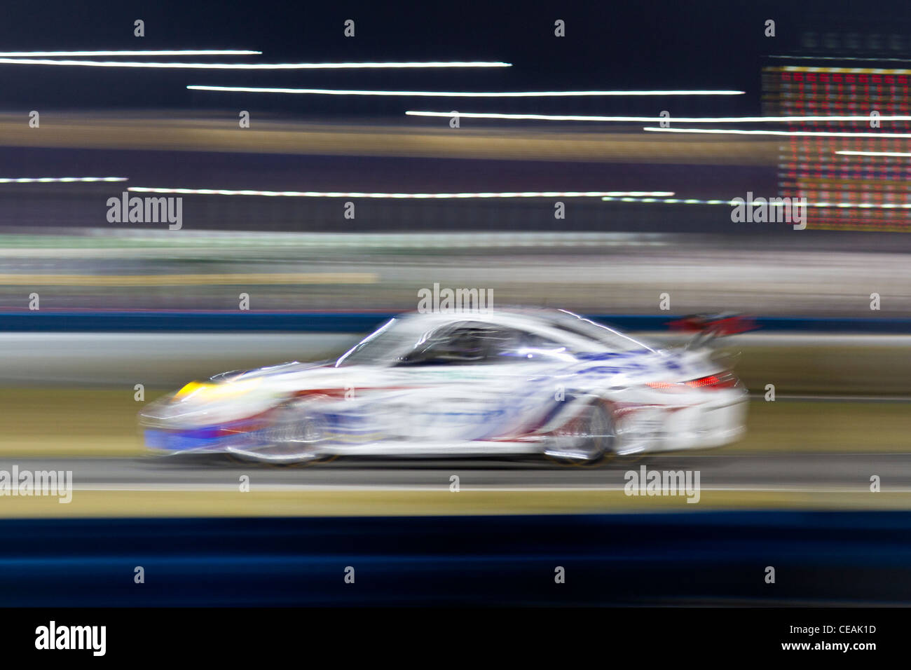 Abstract di Grand-Am Porsche sports car racing durante il 2012 Rolex 24 Ore di Daytona al Daytona International Speedway Foto Stock