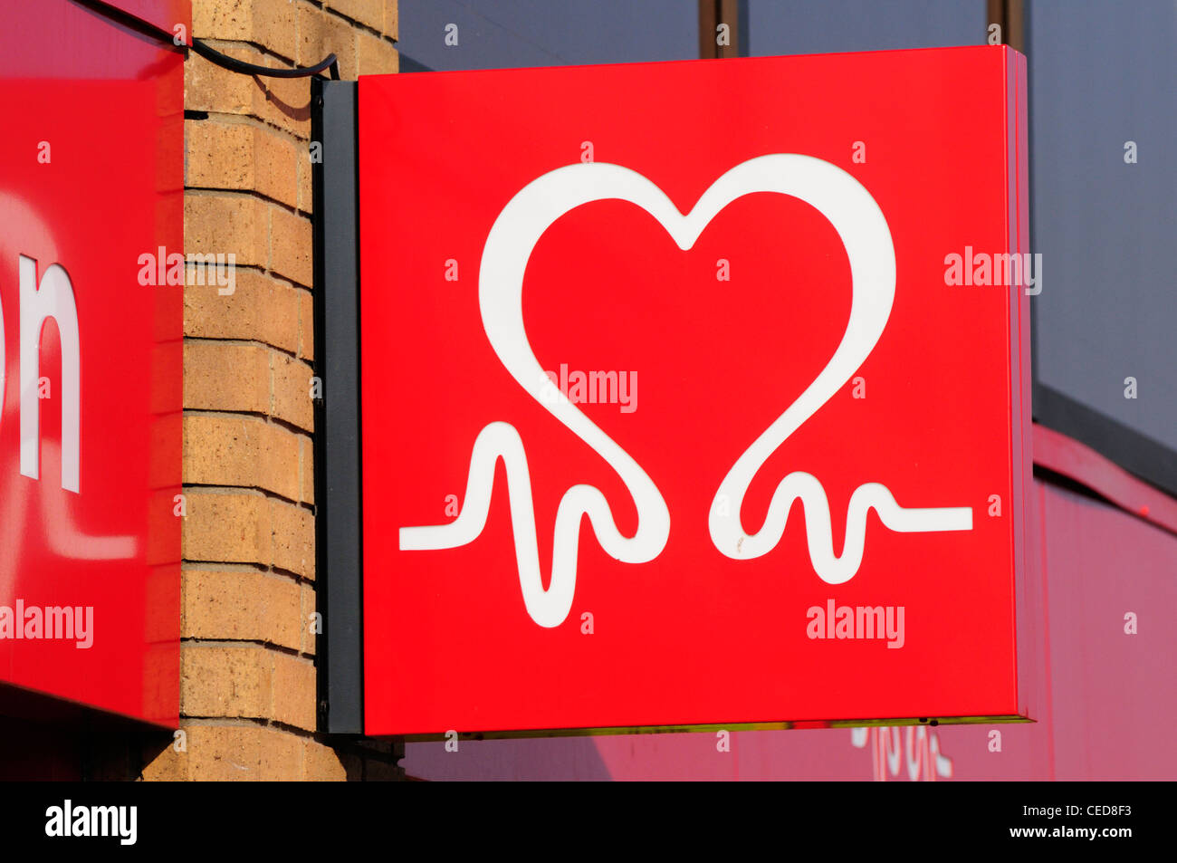 British Heart Foundation carità shop segno Logo, Cambridge, Inghilterra, Regno Unito Foto Stock