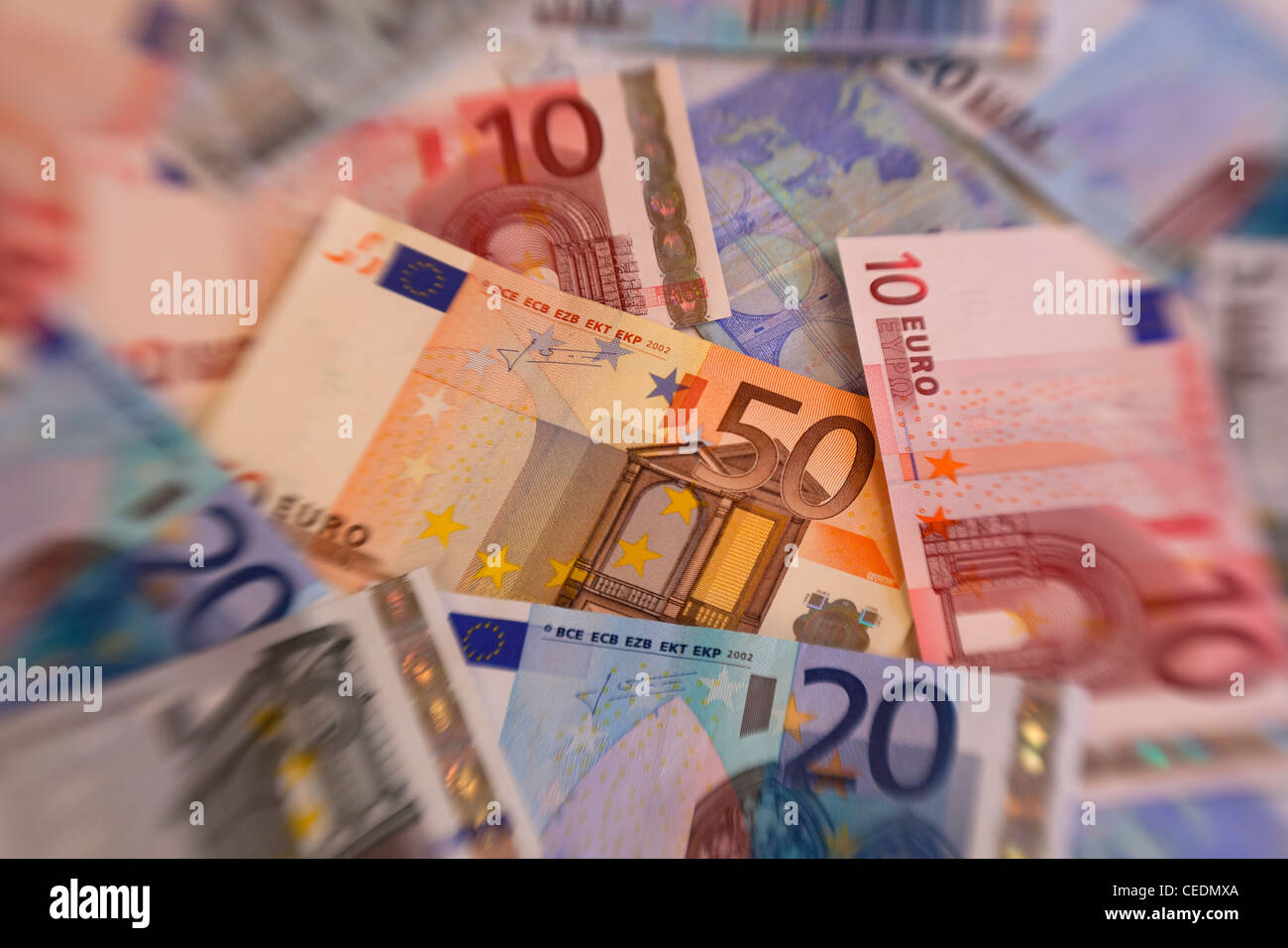 Un mucchio di Euro moneta note di denaro Foto Stock