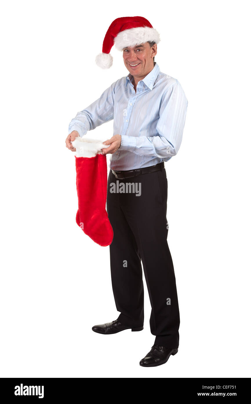 A piena lunghezza Ritratto di sorridenti business man in Santa Hat lieta con contenuto di calza di Natale Foto Stock
