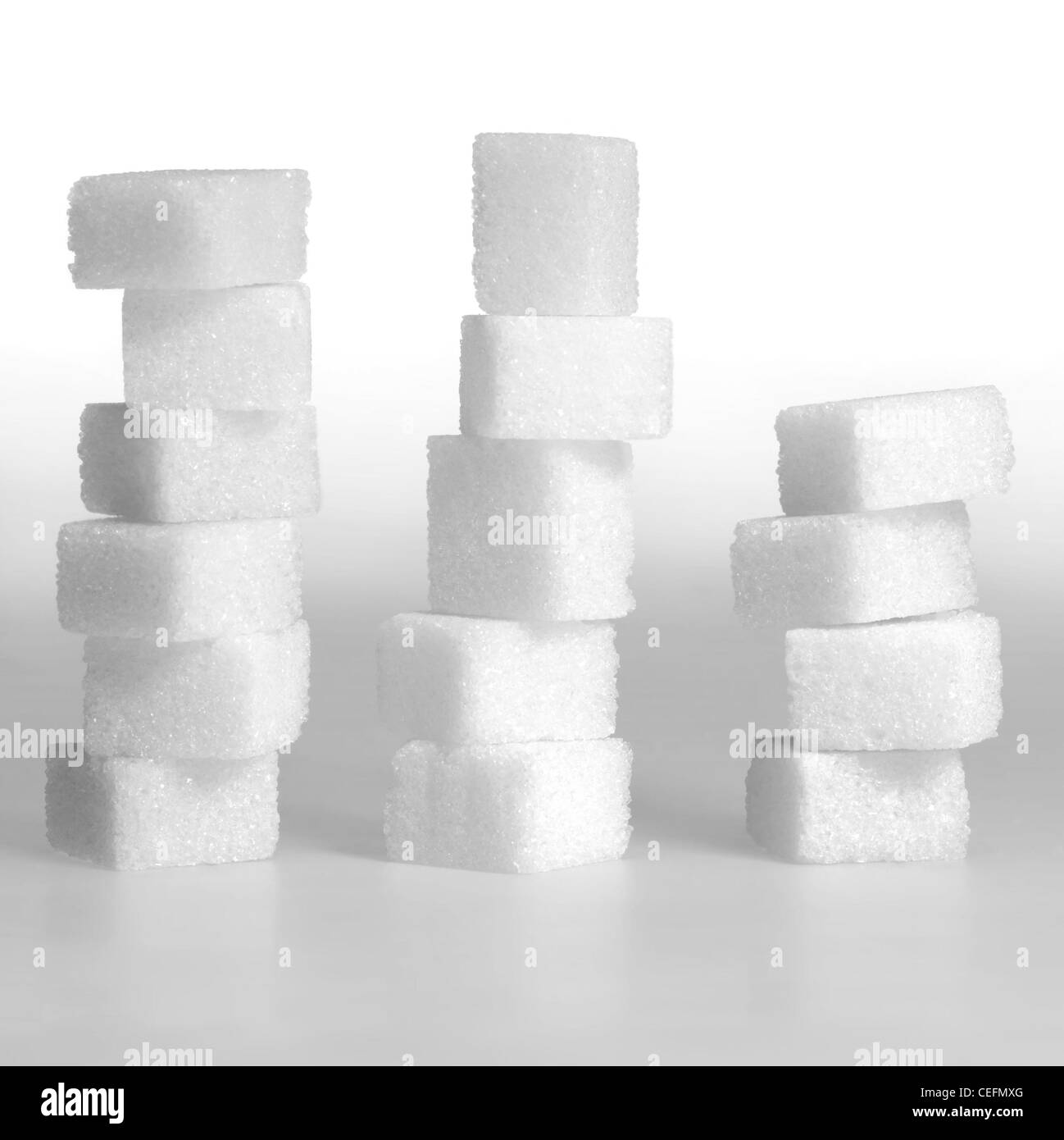 Studio fotografico di grumo 3 pile di zucchero in leggero pendio indietro Foto Stock