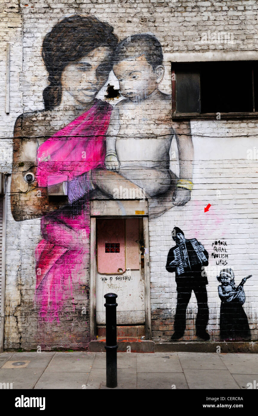 Street murales in Hanbury street, off Brick Lane. Foto Stock