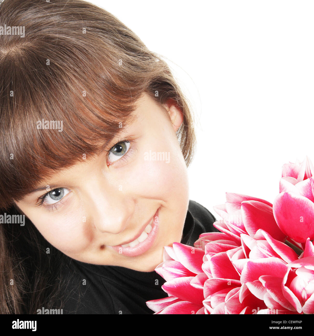 Sorridente ragazza con i fiori Foto Stock