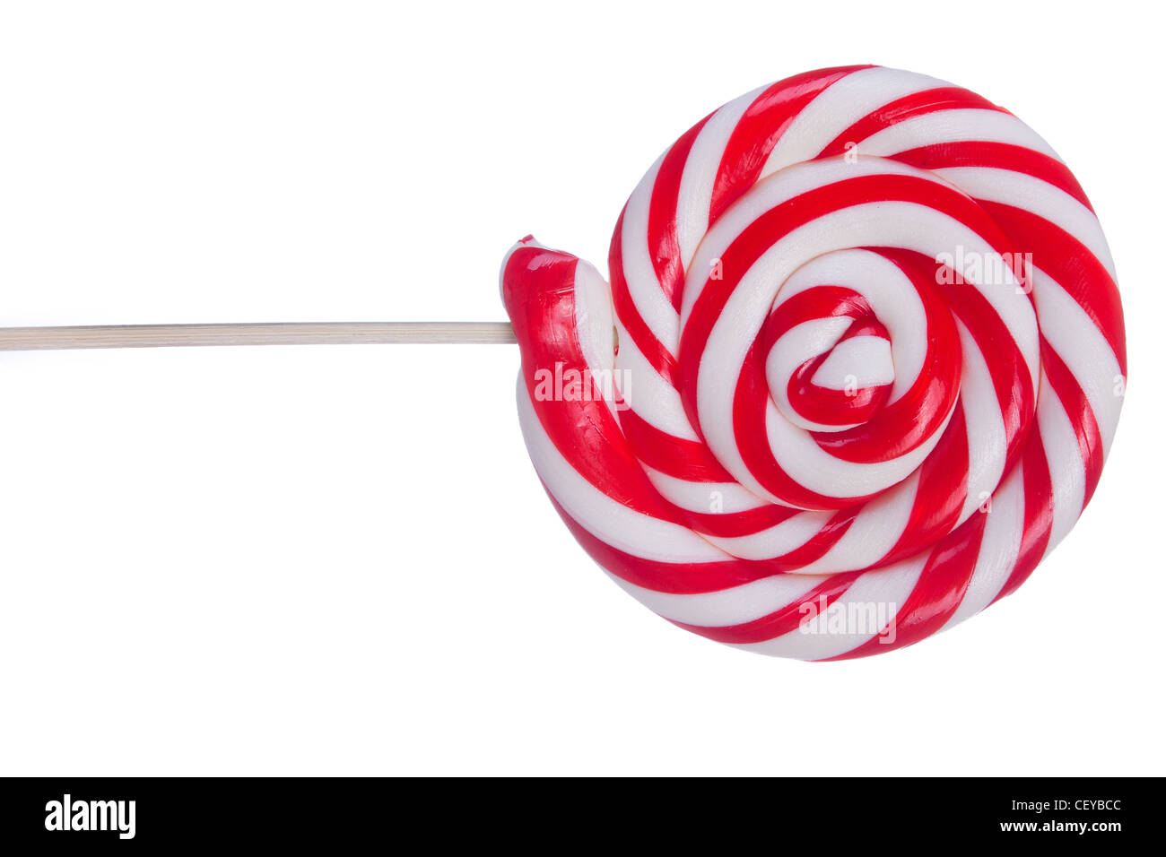 Bella lollipop con strisce rosse e bianche su sfondo bianco Foto Stock