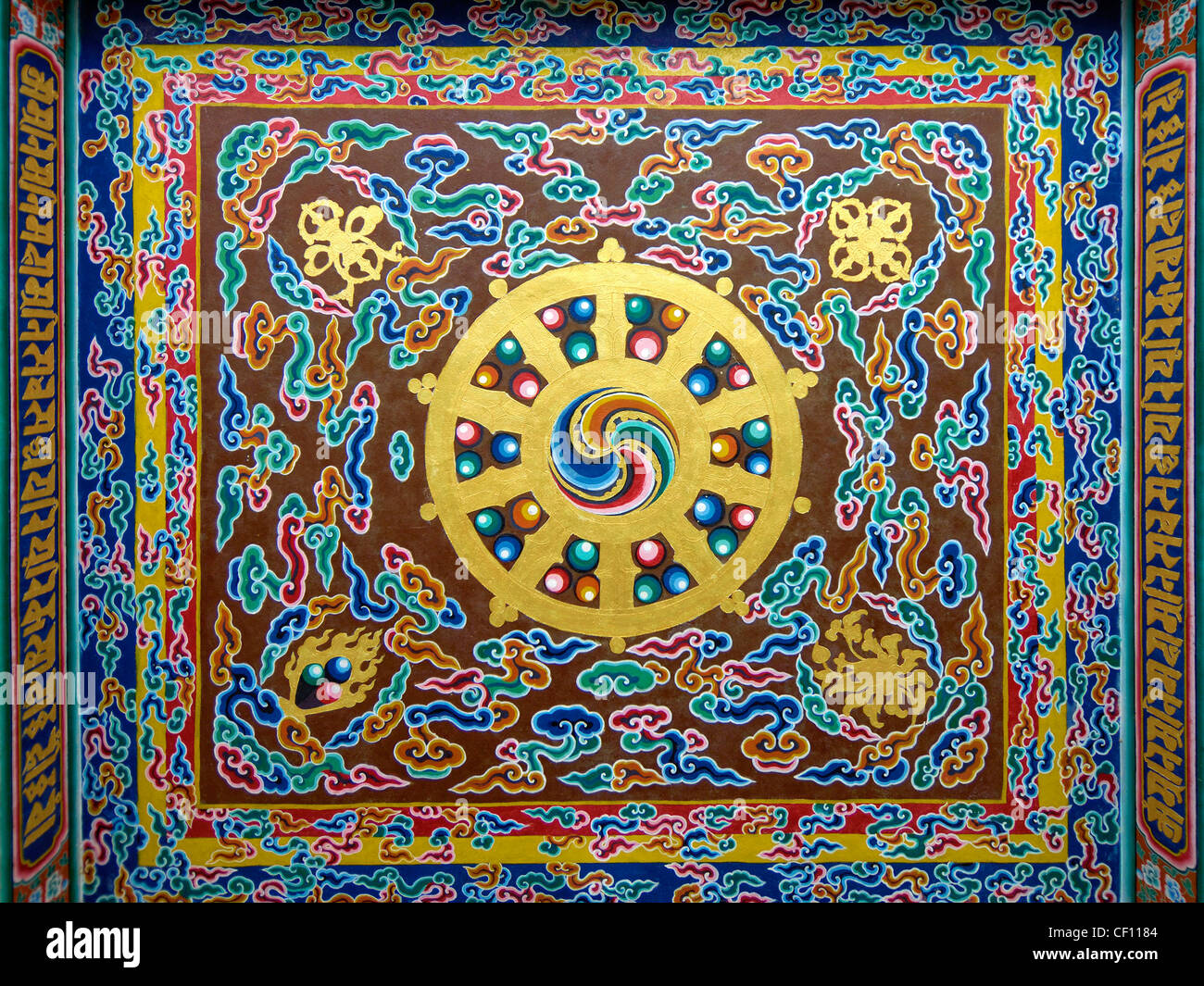 Dharmachakra Dharma Chakra Buddista Tibetana simbolo sacro Foto Stock